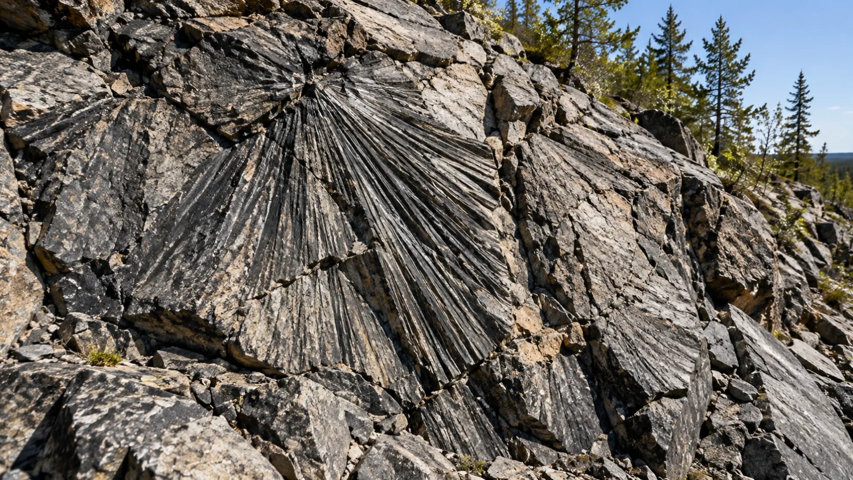 O que liga o antigo impacto de Sudbury às jazidas de níquel e cobre?